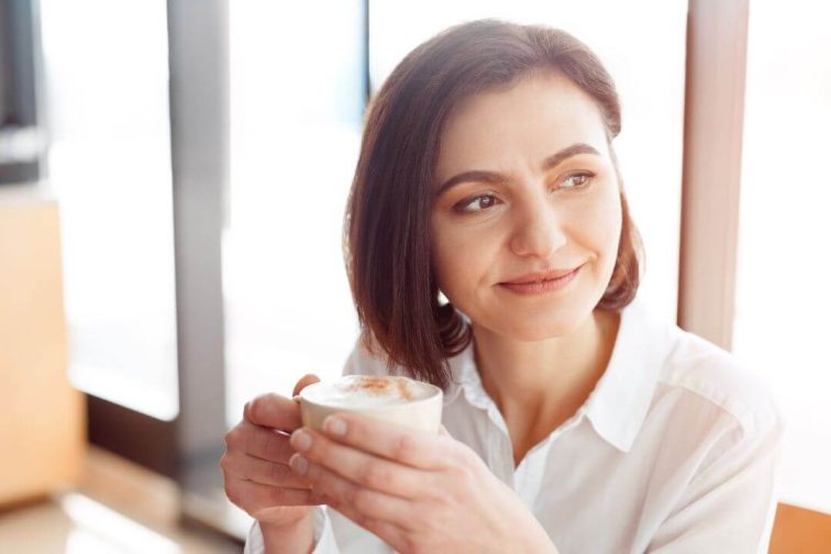 Smiling woman with coffee
